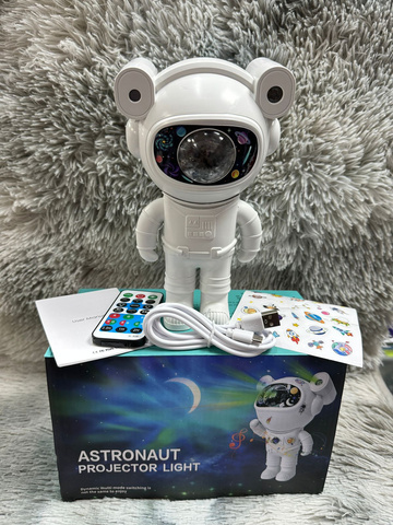 Proyector de galaxia astronauta con bocina